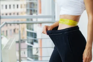 woman in oversize pants after weight loss diet co 2025 02 25 03 30 47 utc